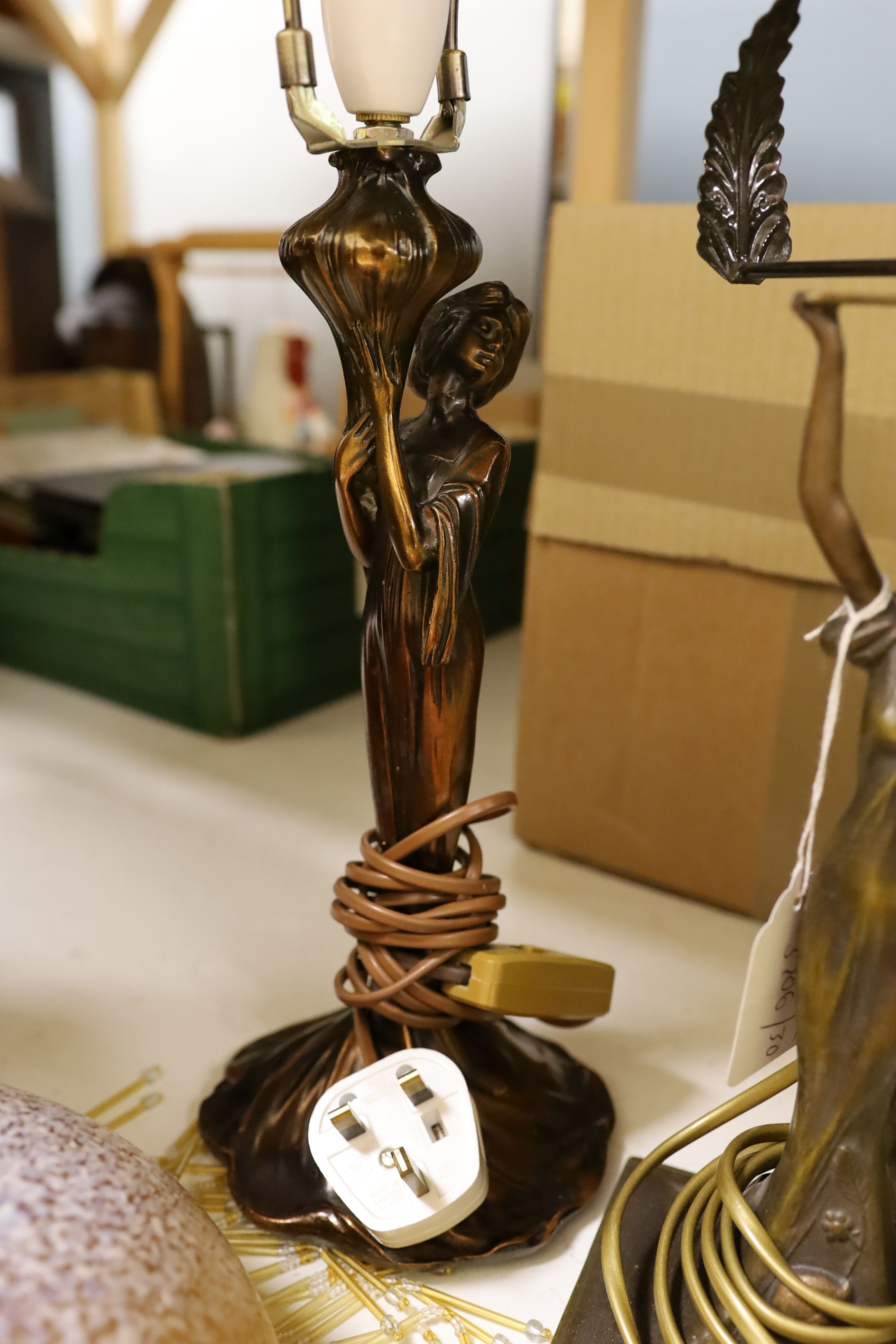 A pair of metal figural table lamps